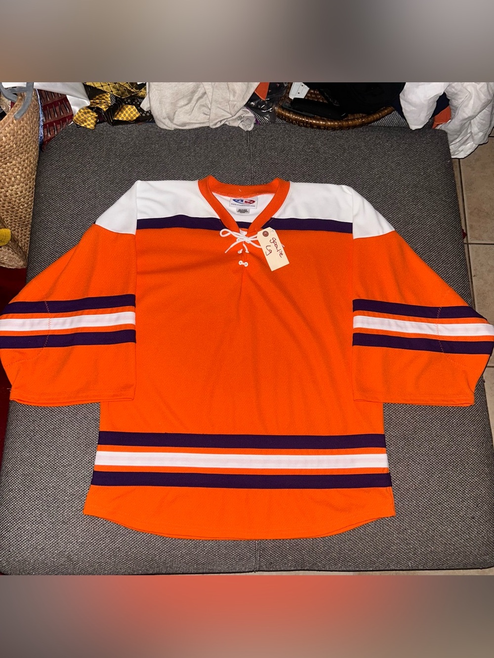 Vintage Orange NHL Goalie Hockey Jersey with Purple & White Stripes